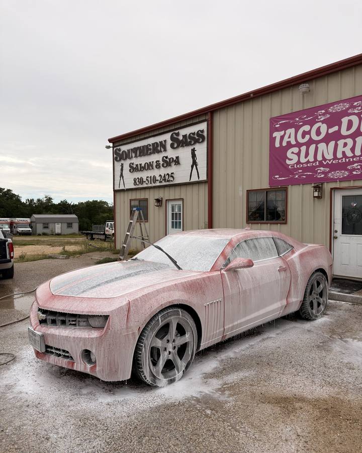 Red Camaro being washed before