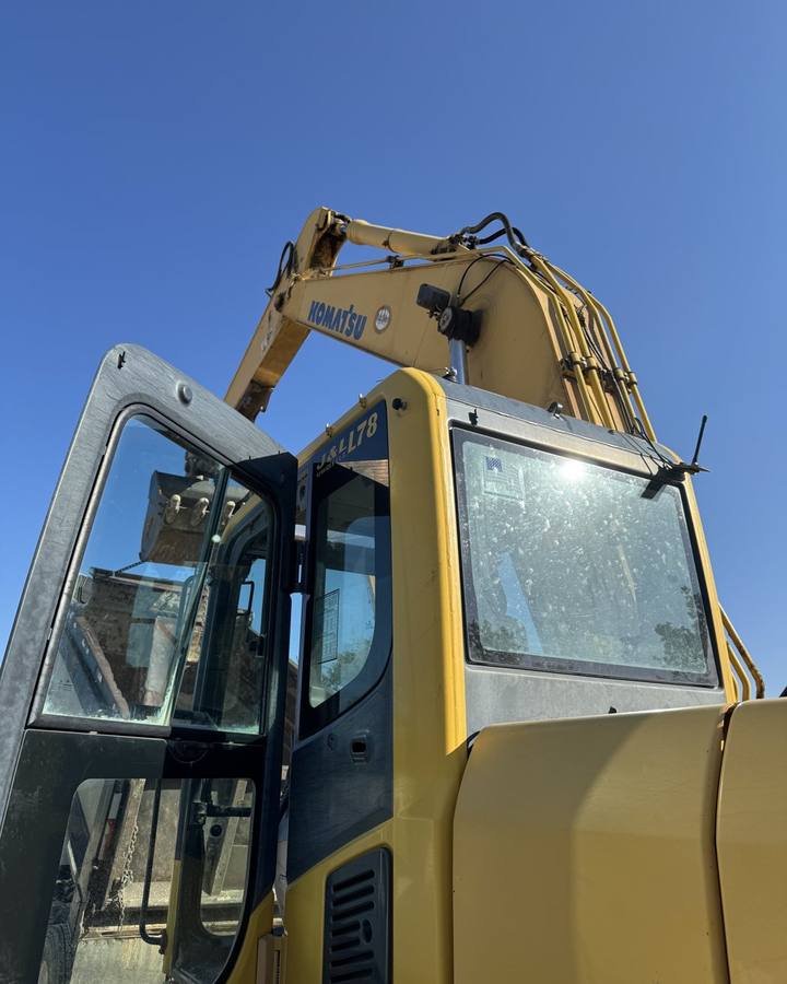 Komatsu excavator cab glass after